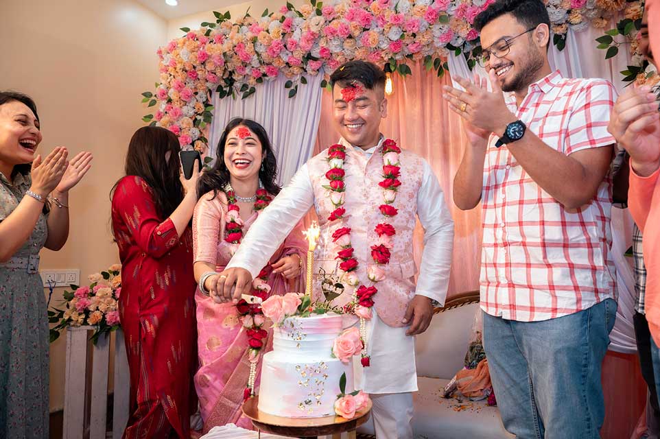 Nepali Engagement Ceremony, Boy in Pink and White Kurta, Girl in Pink Saree, Engagement Celebration with Cake Cutting, Celebrating Love and Togetherness in Engagement Ceremony, Jalpaiguri engagement  highlights, Siliguri Photography, Best Nepali Wedding Photographer In Jalpaiguri.